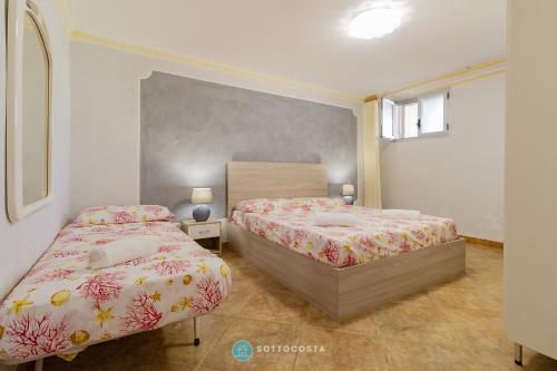 Ένα ή περισσότερα κρεβάτια σε δωμάτιο στο Iris Flat - San Foca