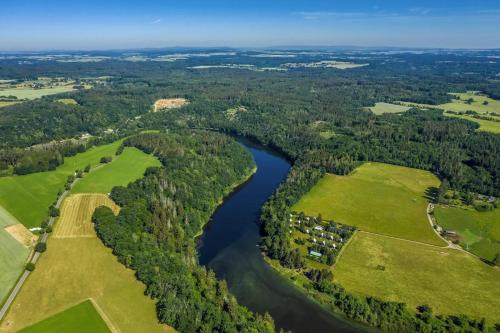 an aerial view of a river and trees at Chata Abrinka - Chaty Na Rybárně in Louka