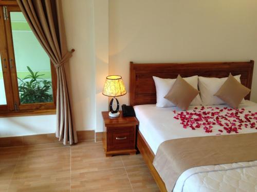 Ένα ή περισσότερα κρεβάτια σε δωμάτιο στο Ngoc Viet Bungalow