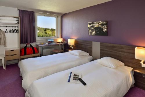 Postel nebo postele na pokoji v ubytování Als Hôtel