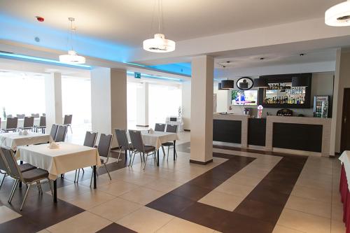Un restaurant sau alt loc unde se poate mânca la Papaver Hotel