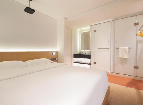 Postel nebo postele na pokoji v ubytování Yolo Vacation Homestay