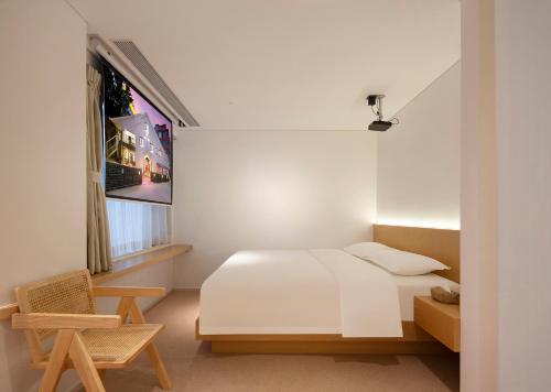 Postel nebo postele na pokoji v ubytování Yolo Vacation Homestay
