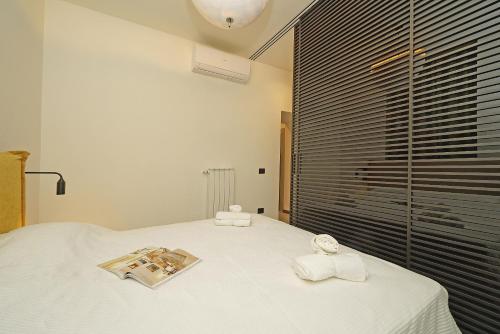 Una cama o camas en una habitación de Gemhouse Ambra garda lake