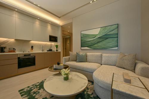 a living room with a couch and a table at Onyx Rotana in Manama