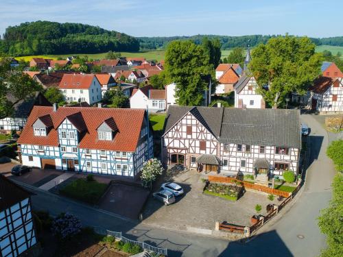 an aerial view of a town with a large house at Holiday home in ldernTwistetal Oberwaro with sauna in Oberwaroldern