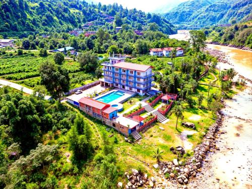an aerial view of a house next to a river at River Beach Resort - Trishuli in Benighāt