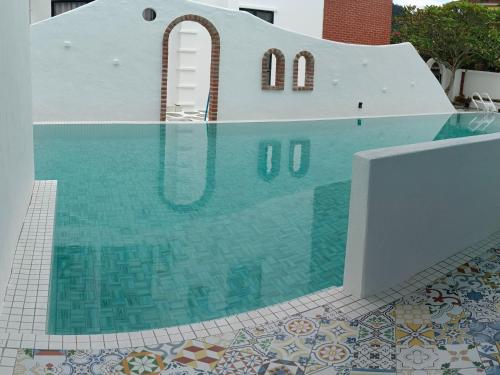The swimming pool at or close to Ipoh Santorini Hideaway - Hotel Inspired