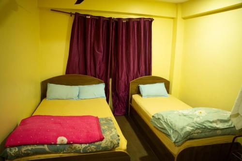 Postel nebo postele na pokoji v ubytování Universal Hotel & Lodge - Gorkha