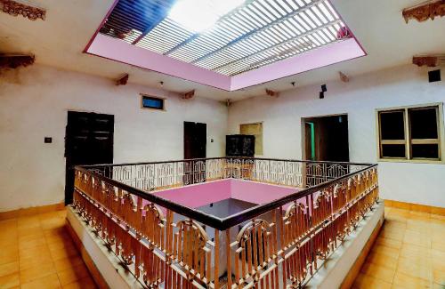 a large room with a balcony with a skylight at SPOT ON Mishra Guest House in Varanasi