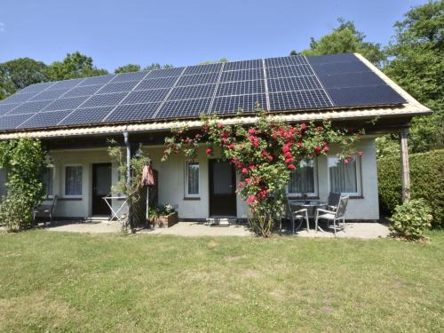 a house with solar panels on the roof at Tasteful Holiday Home in Neubukow with Terrace in Neubukow