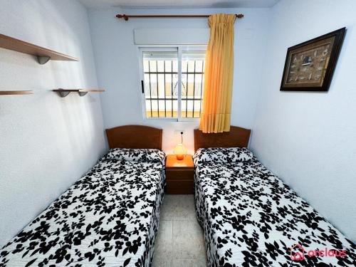 Postel nebo postele na pokoji v ubytování Escapada Marina