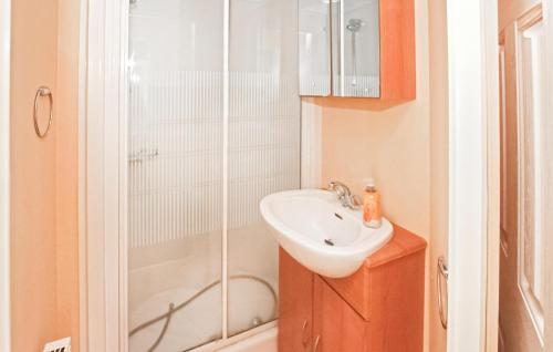 a small bathroom with a sink and a shower at Gorgeous stacaravan In Rheinsberg Ot Kagar With Wifi in Kagar