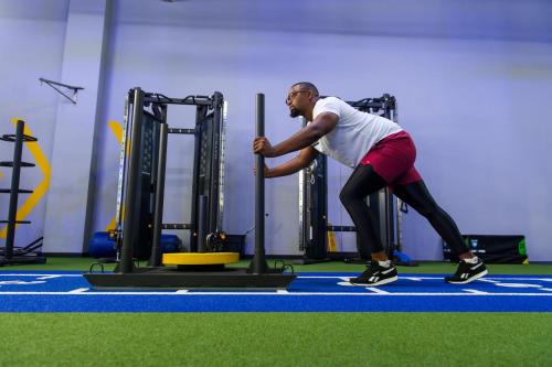 a man in a gym playing with a pole at The Capital Pearls Hotel in Durban