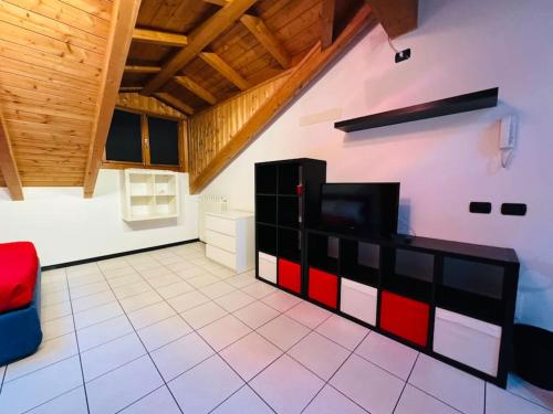 a living room with a tv on a wall at La casa di Vale in Arona