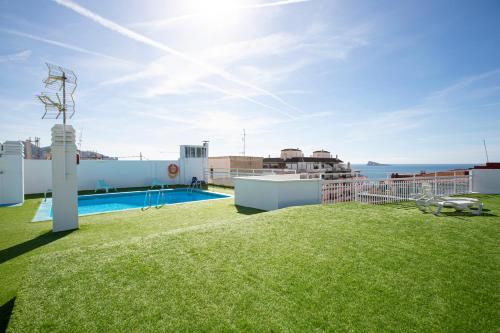 a view of the rooftop of a building with a lawn at FLEMING PLAYA PONIENTE in Benidorm