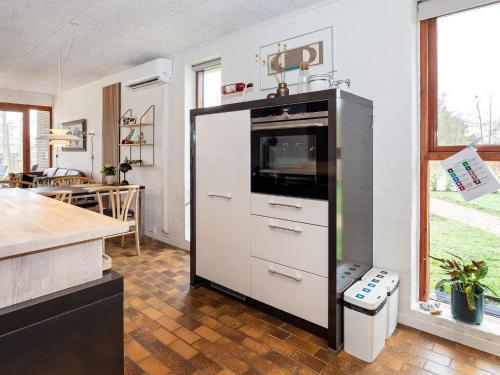 a kitchen with a refrigerator with a counter top at 5 person holiday home in Thyholm-By Traum in Thyholm