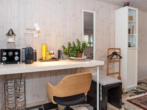 a kitchen with a counter and a chair at 5 person holiday home in Thyholm-By Traum in Thyholm