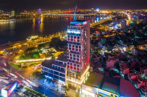 an aerial view of a city at night at Vanda Hotel in Da Nang