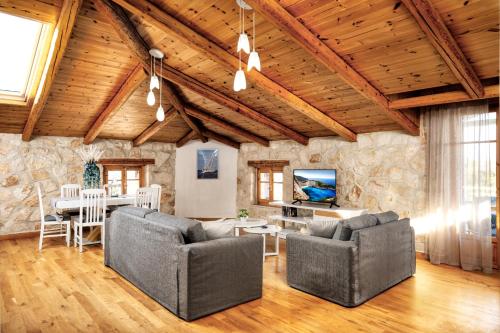 A television and/or entertainment centre at Mirabilia Loft - Amazing Views and Steps from Banana Beach
