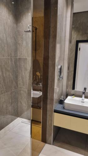 a bathroom with a sink and a shower at Sea Breeze Lighthouse 3 in Baku