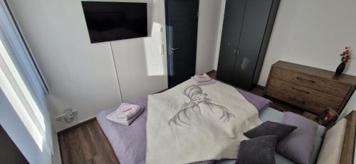 a room with a bed with a spider on it at Haus Ludwig in Freudenstadt