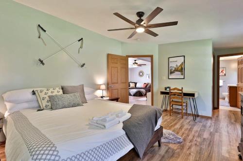 a bedroom with a large bed with a ceiling fan at Blueberry Hill Escape Pet Friendly HotTub Fire pit in Bridgewater