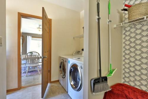 a laundry room with a washing machine and a red rug at Blueberry Hill Escape Pet Friendly HotTub Fire pit in Bridgewater