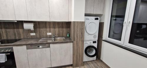 a kitchen with a washing machine and a washer at Haus Ludwig in Freudenstadt