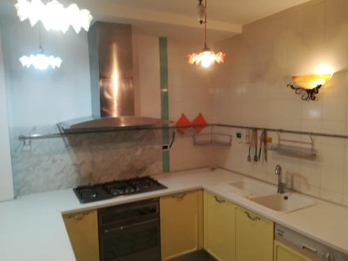 a kitchen with a sink and a stove top oven at Beach casa sul mare in Termoli