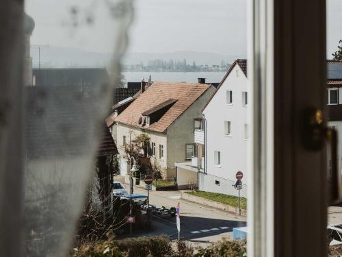 a view of a building from a window at Ferienwohnung Bodenseeblick in Allensbach