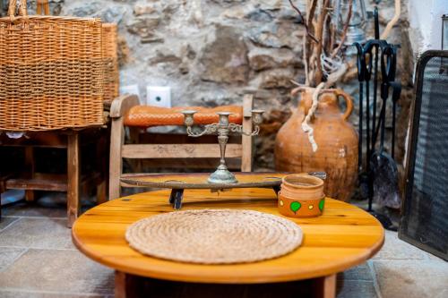 a wooden table with a scale on top of it at Conchiglia Village House in Kiotari