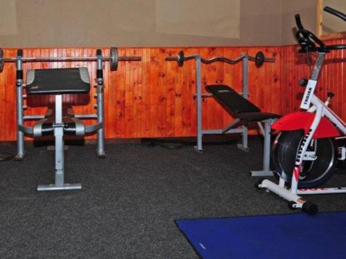 a gym with two treadmills and a bicycle and a exercise bike at Port St Johns River Lodge in Port St Johns