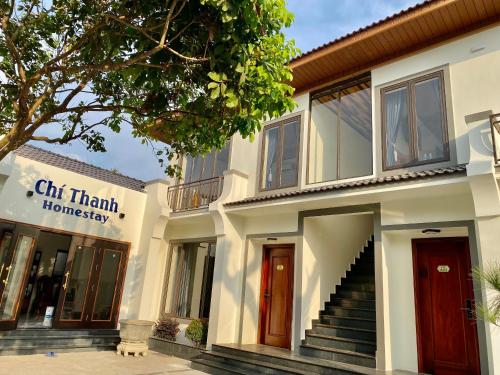 a building with a staircase in front of it at Chí Thanh Homestay in Pleiku