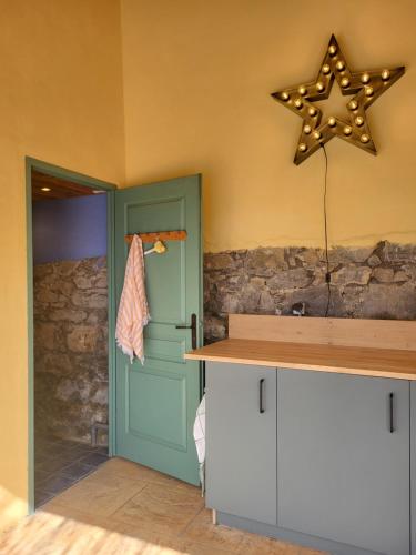 a room with a star hanging on the wall at La Villa Bellevue Anduze in Anduze