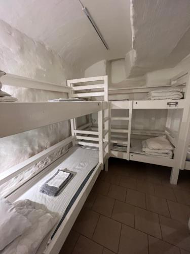 a room with two bunk beds in a room at Hostel Dalagatan in Stockholm