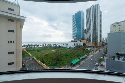 a view from a window of a city with buildings at PĀMA Boutique Hotel & Bistro in Da Nang