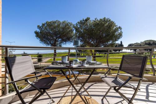 a table and two chairs on a balcony at Galo Luxury House in Rome