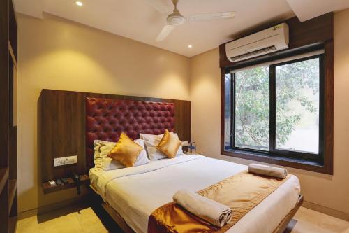 En eller flere senge i et værelse på Hotel Sea Breeze