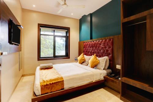 En eller flere senge i et værelse på Hotel Sea Breeze