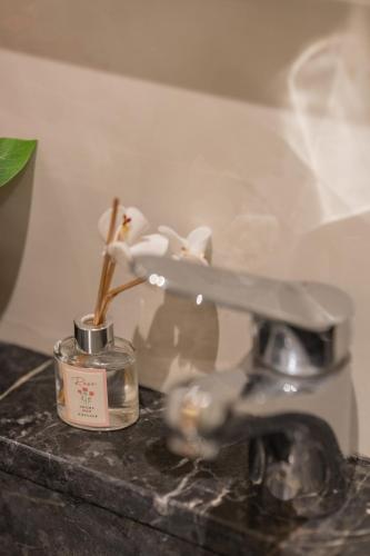 a close up of a scale with a flower in a jar at Appart Hôtel Rambla in Marrakech