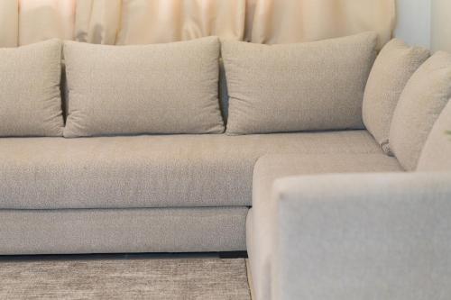 a couch with two pillows on top of it at Appart Hôtel Rambla in Marrakech