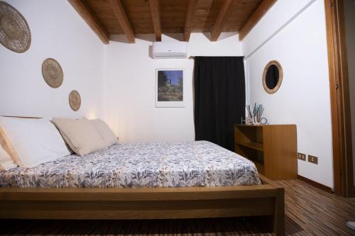 a bedroom with a bed in a room at Montesanto 13 in Palermo