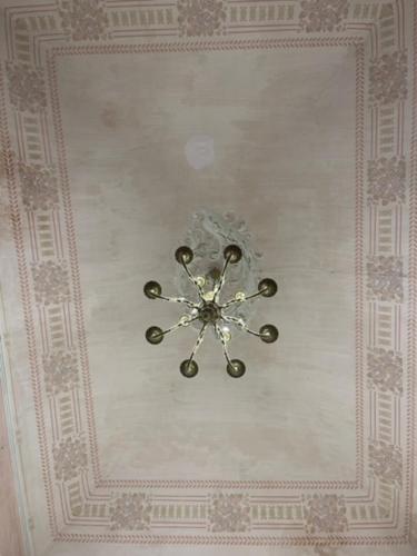 a clock on the ceiling of a room at Umberto House Catania in Catania