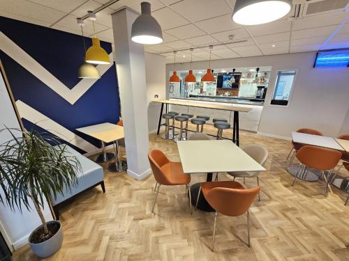 an office with tables and chairs and a counter at ibis budget Derby in Derby