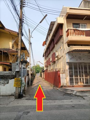 an image of a street with an arrow pointing up at The Old City Rooms in Chiang Mai