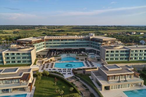 an aerial view of a building with a swimming pool at Kempinski Hotel Adriatic Istria Croatia in Savudrija