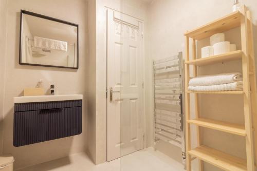 a bathroom with a sink and a mirror at GuestReady - Tranquil Slumber in The Coast in Dublin