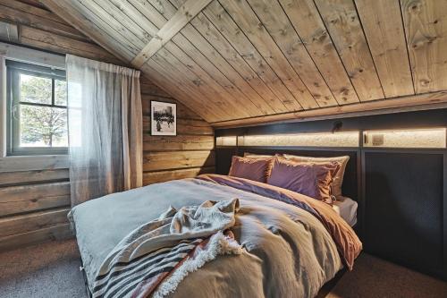Ένα ή περισσότερα κρεβάτια σε δωμάτιο στο Chalet Strandafjellet