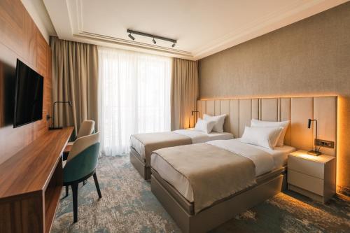 Ένα ή περισσότερα κρεβάτια σε δωμάτιο στο Hotel Kocka Vrnjačka Banja
